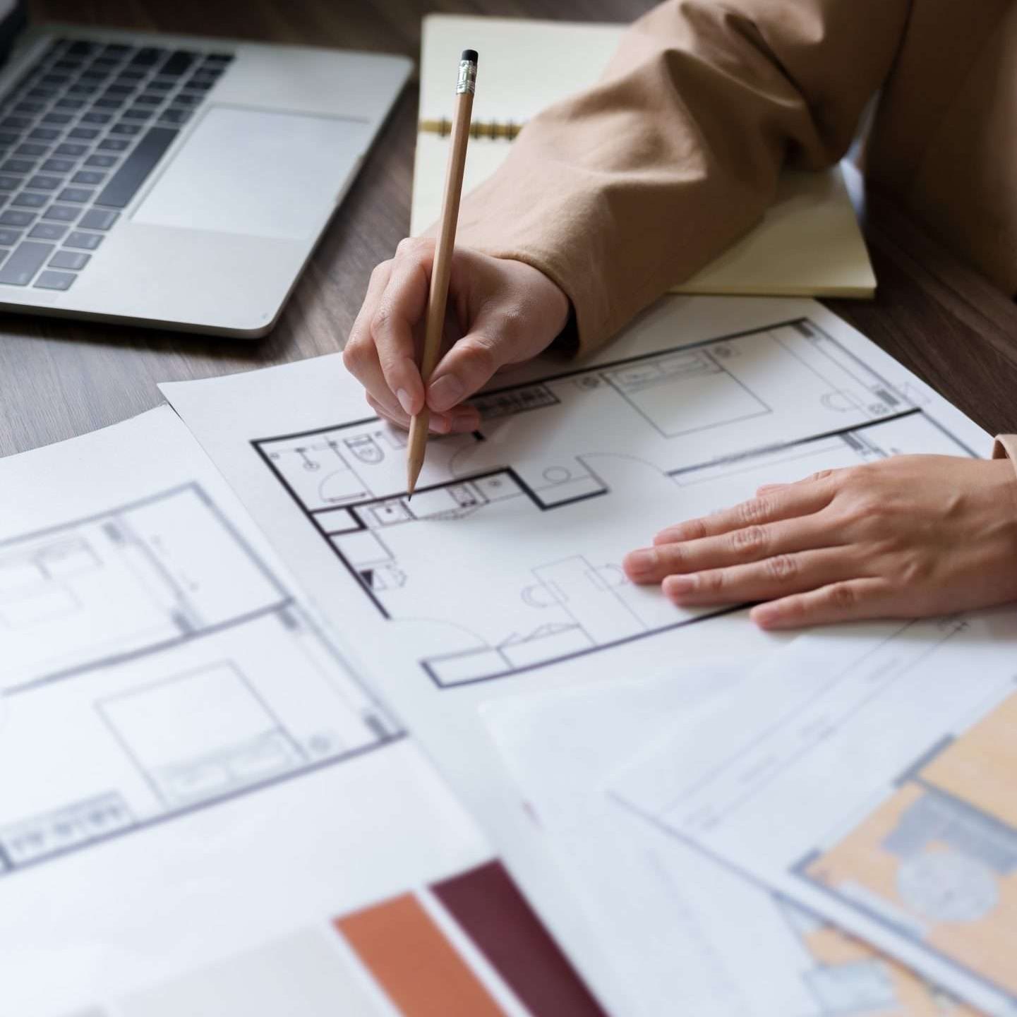 Engineer or interior Architects designer construction plans on blueprint.