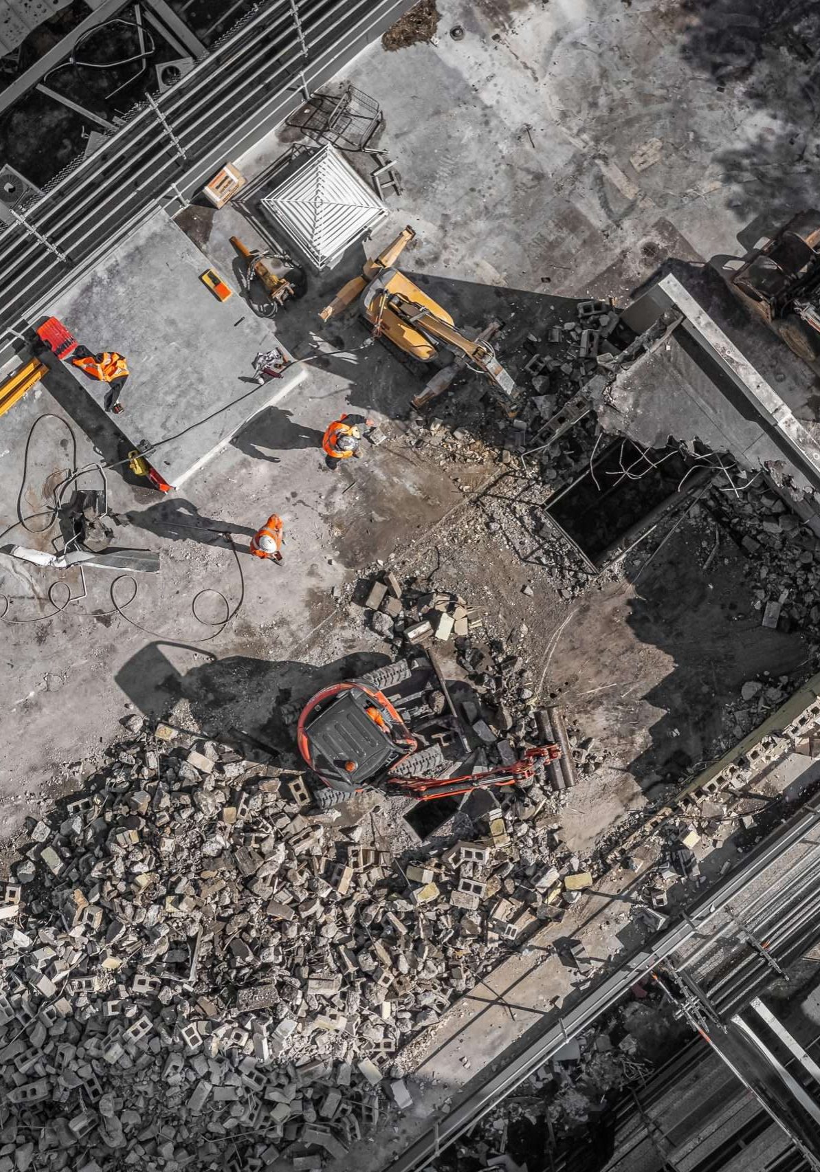 Aerial drone photo of demolition site and construction workers